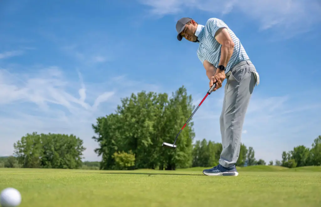Person in action on golf course