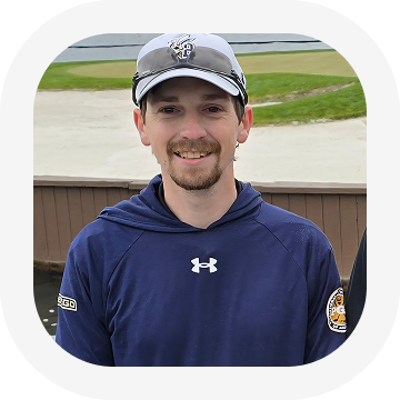 Man wearing sports cap and hoodie outdoors